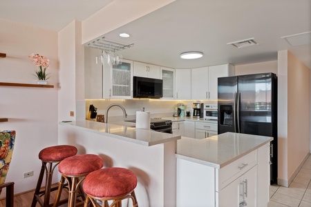 Fully stocked kitchen with bar seating