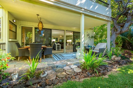 Ground lanai with table~ seating for four and a seating area.