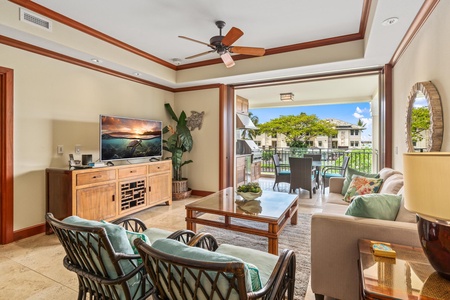 Relax in the cozy living room with peaks of the ocean