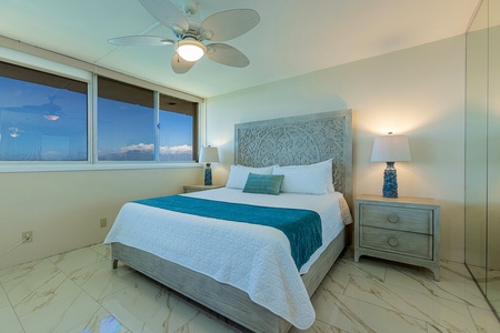 Primary suite with ocean view and private bath.