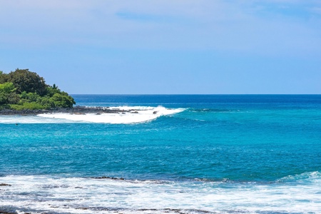 Relax and watch the surfers at iconic Banyans 