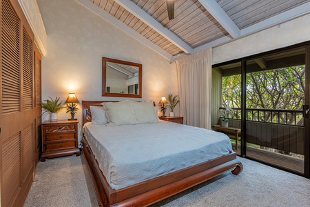 Comfortable King bed and private lanai off the bedroom