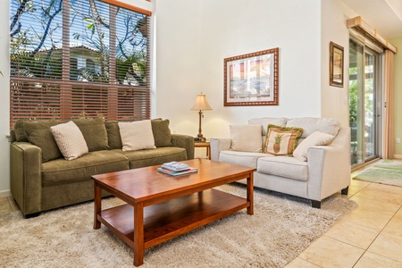 Large window in the living room allows for natural light or enjo