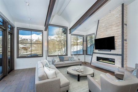 Modern living room with amazing views, vaulted ceilings, gas fireplace, private deck access