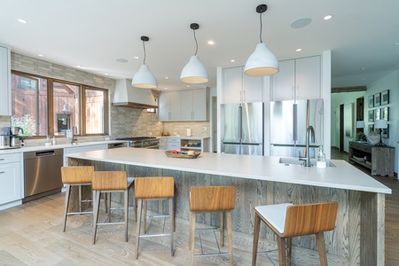 Chef's kitchen with huge kitchen island and bar seating for 6