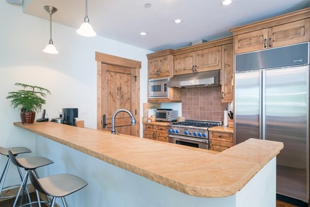 Fully appointed kitchen with bar seating