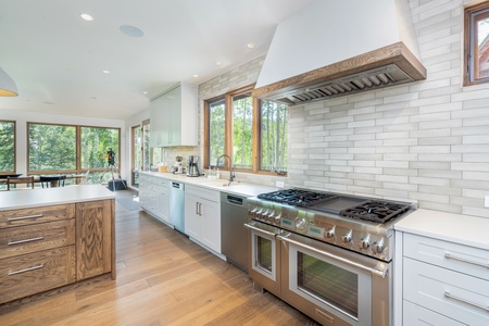 Fully appointed kitchen highlighted by the professional 48 gas range