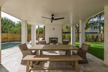 More outdoor dining sits just between your swimming pool and putting green