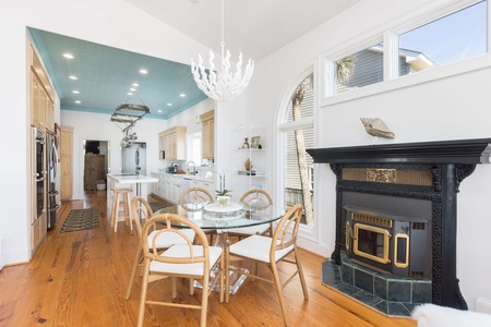 A breakfast nook sits just off the kitchen with a functioning fireplace