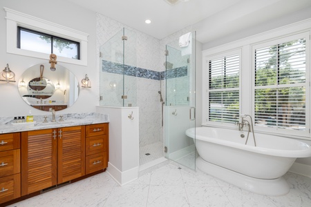 Unwind in the large soaking tub or use the glass walk-in shower