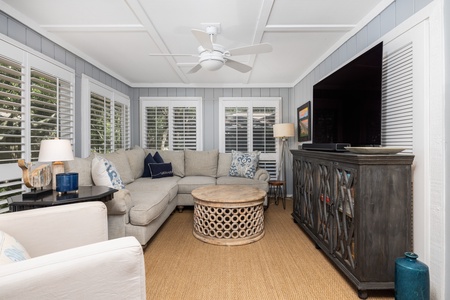 Your sun room features a large tv and ample seating