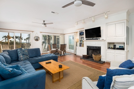 Your living room features a large television above the fireplace