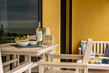 Picture yourself savoring morning coffee and evening wine on your private balcony, where warm sunshine meets comfortable seating.