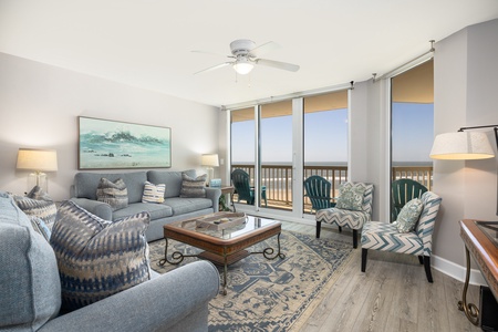 Your living room features ample seating, natural light, and access to your private terrace