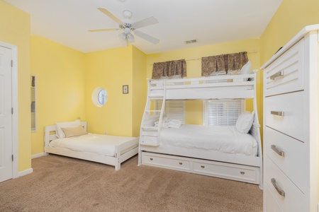 The bunk room features an en suite bathroom and a separate twin bed