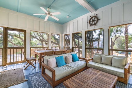 Spend your mornings sipping coffee in your nautical screened-in porch