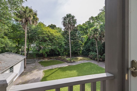 Nicely landscaped view of the back yard