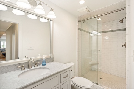 The ground level features two additional bathrooms with full showers