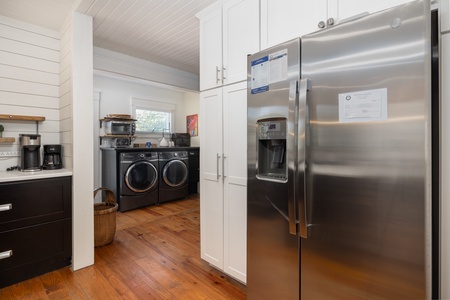 Step through the kitchen to access your laundry room