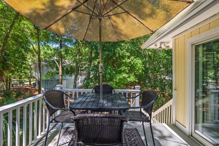 Relax on your private deck surrounded by lush trees
