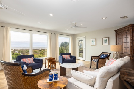 Access one of two patios overlooking the pool and putting green from the sitting room