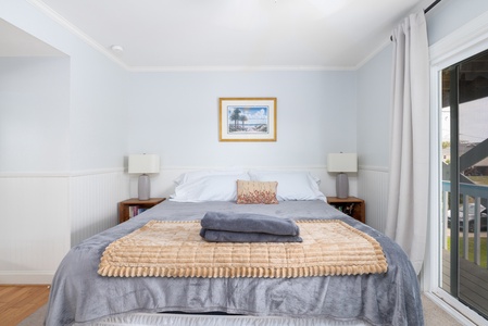 Your primary king bed features a comfortable memory foam mattress
