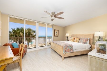 The spacious primary bedroom features a king size bed and en suite bathroom