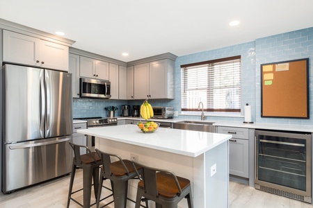 A bright, modern kitchen is ready with all of your cooking needs