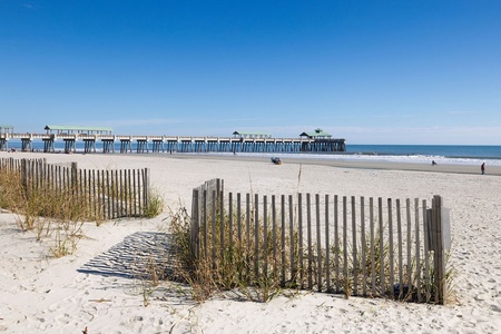 Beautiful white sand beach with the Folly Pier in the distance.