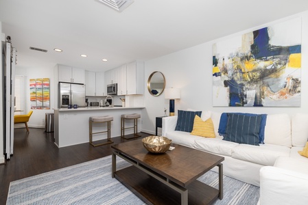 Your open-concept living space flows seamlessly between the kitchen and living room