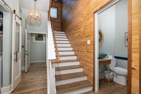 Just behind the kitchen is the half bath and stairs to your second floor
