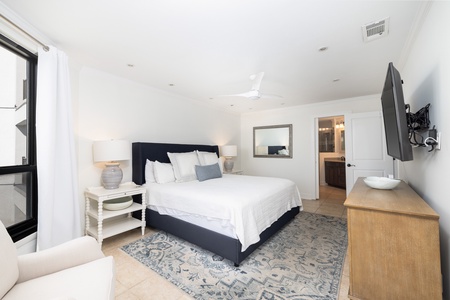 Your primary bedroom features a king size bed and en suite bathroom