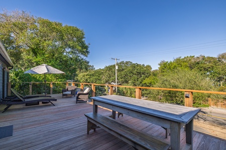 Your spacious back deck is surrounded by lush greenery