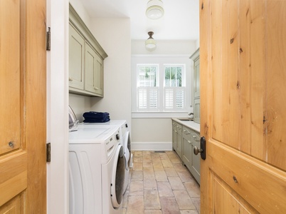 Next to the grand dining room is your laundry room