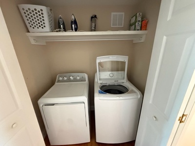 Your dedicated laundry area keeps your vacation wardrobe fresh with full-size washer and dryer, plus convenient shelf storage for supplies.