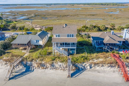 Beachfront vacation home with direct beach access and stunning coastal marsh views in pristine natural setting.