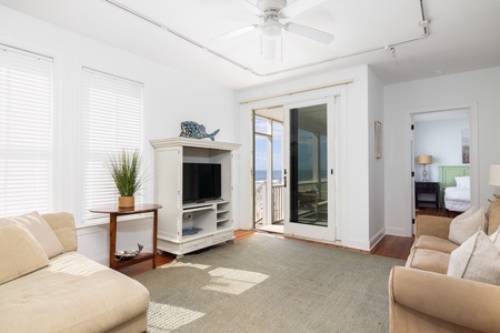 Take the sliding doors to your beachfront covered porch
