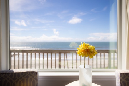 Wake up to endless ocean views stretching across your horizon. Enjoy your morning coffee at this bright dining spot where the sea meets the sky just beyond your window.