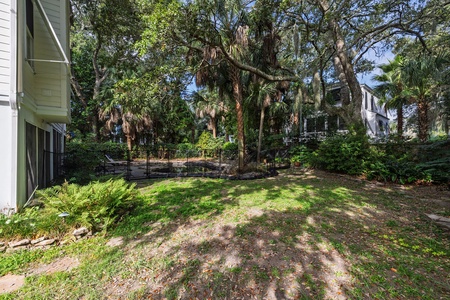 Private backyard retreat surrounded by lush coastal greenery.