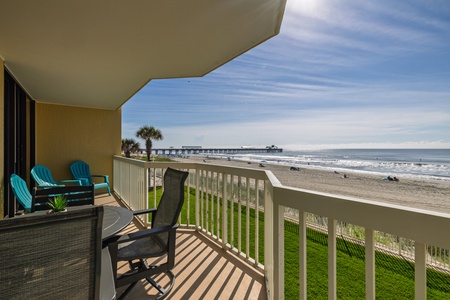 Sip your morning coffee or enjoy sunset breezes from your private balcony — oceanfront balcony with panoramic views at Sand Fort @ FB