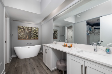 Your primary en suite features a deep soaking tub and marble walk-in shower