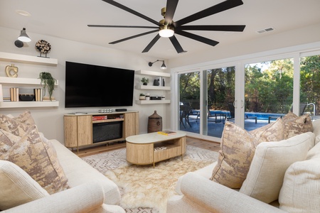 Lounge in your bright and airy living room with doors leading right out to your private backyard oasis