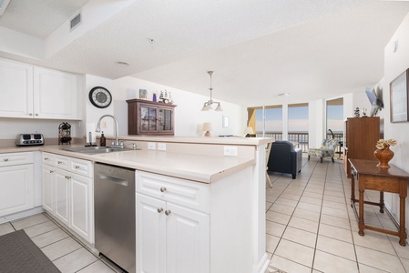 Your fully equipped kitchen features everything needed for home cooking, with stunning ocean views creating the perfect backdrop for meal preparation.