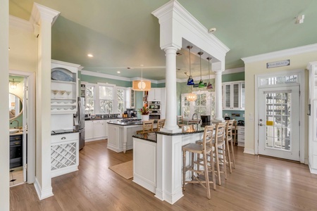 Your large kitchen features elegant columns and a breakfast nook