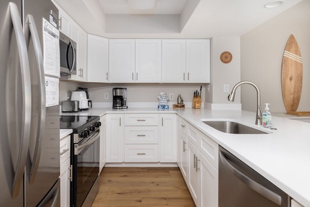 Your fully equipped kitchen features modern appliances and plenty of counter space for preparing beachside meals.
