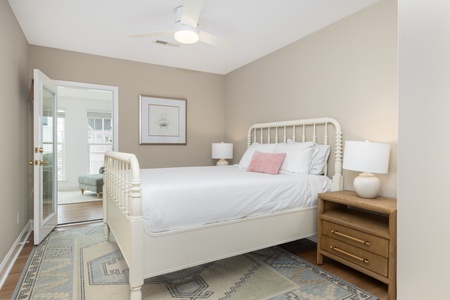 Slip into crisp white linens in your queen bedroom