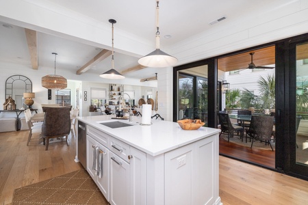 Outdoor dining is just beyond the glass doors from the kitchen