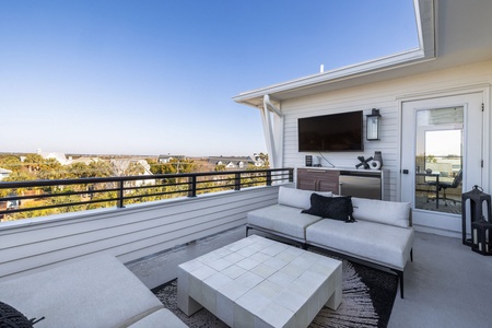 Watch the sunset over the marsh from your rooftop deck