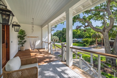 A tranquil covered front porch welcomes you