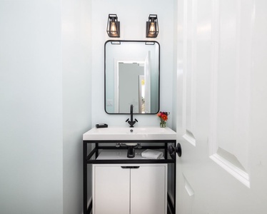 The powder room is conveniently located on the first floor.